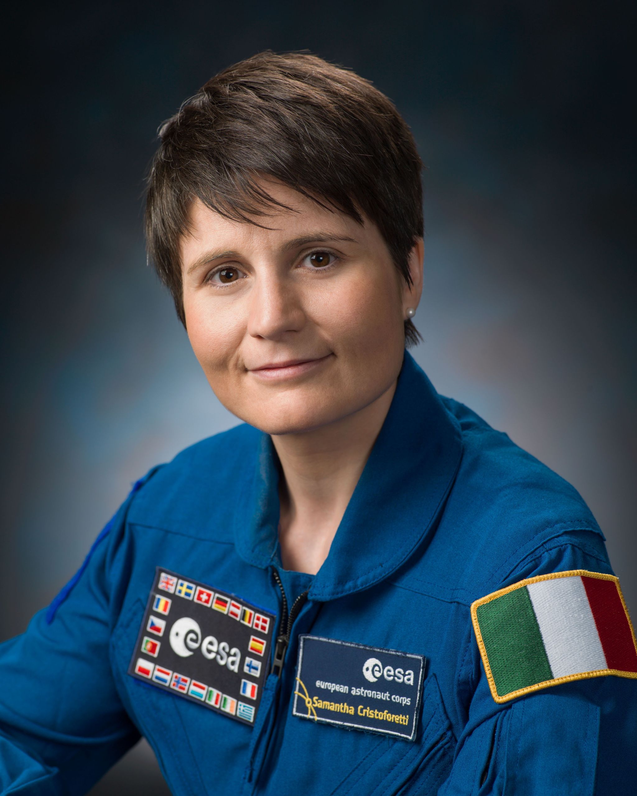 European Space Agency astronaut Samantha Cristoforetti, attired in her blue flight suit.